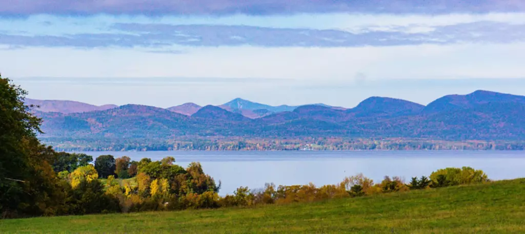 view of Lake Champlain and the Adirondack Mountains in New York from Shelburne Farms in Vermont