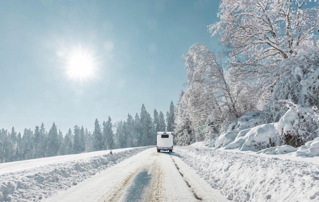 Technician winterizing an RV. 