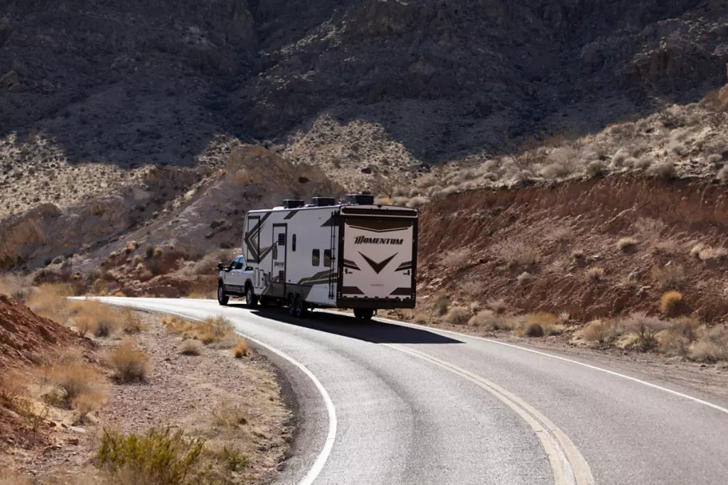 Grand Design Momentum being pulled on a highway. 