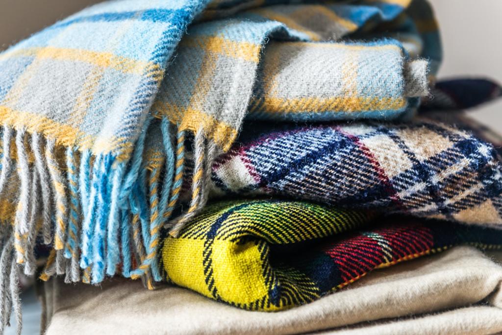 Stack of woolen checked blankets, autumn and winter concept