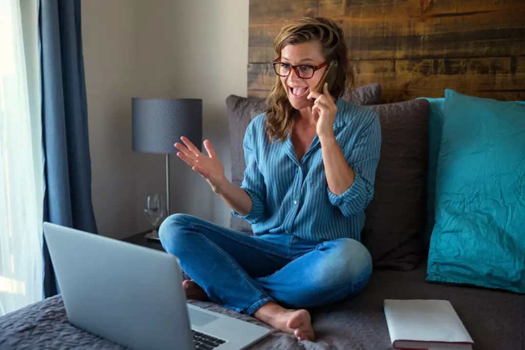 Woman working from home, answer phone calls.