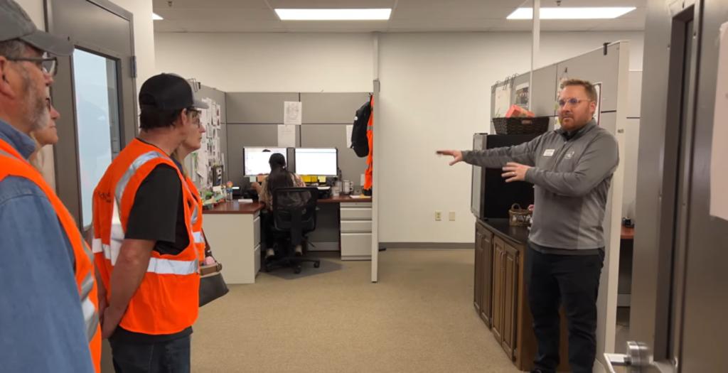 Inside Sales representative giving a tour of the customer service department